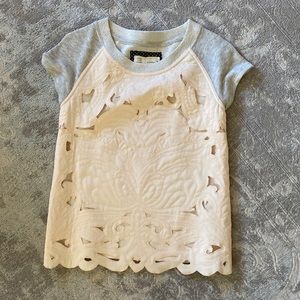 Feminine detailing on a comfy sweatshirt